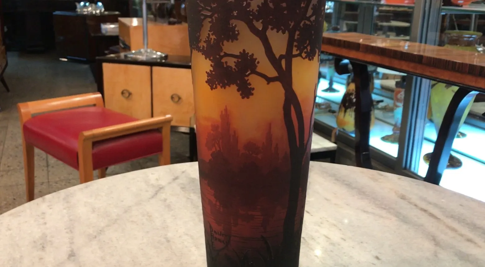 Signed glass Daum Nancy featuring landscape and tree design.