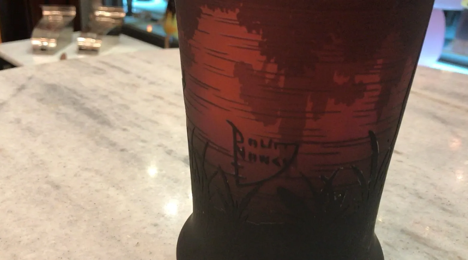 Glass signed Daum Nancy with an antique colorful design.