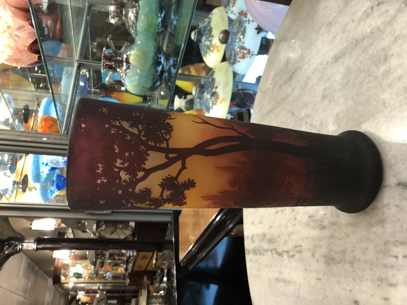 glass vase with tree design in warm tones, antique