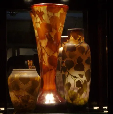 Antique vases featuring floral designs in an elegant setting