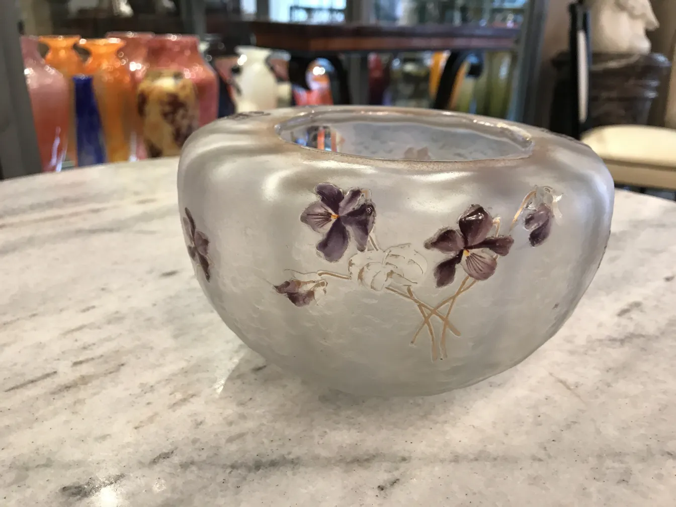 Antique signed glass Daum Nancy with purple flowers on a clear background. Decorative setting.