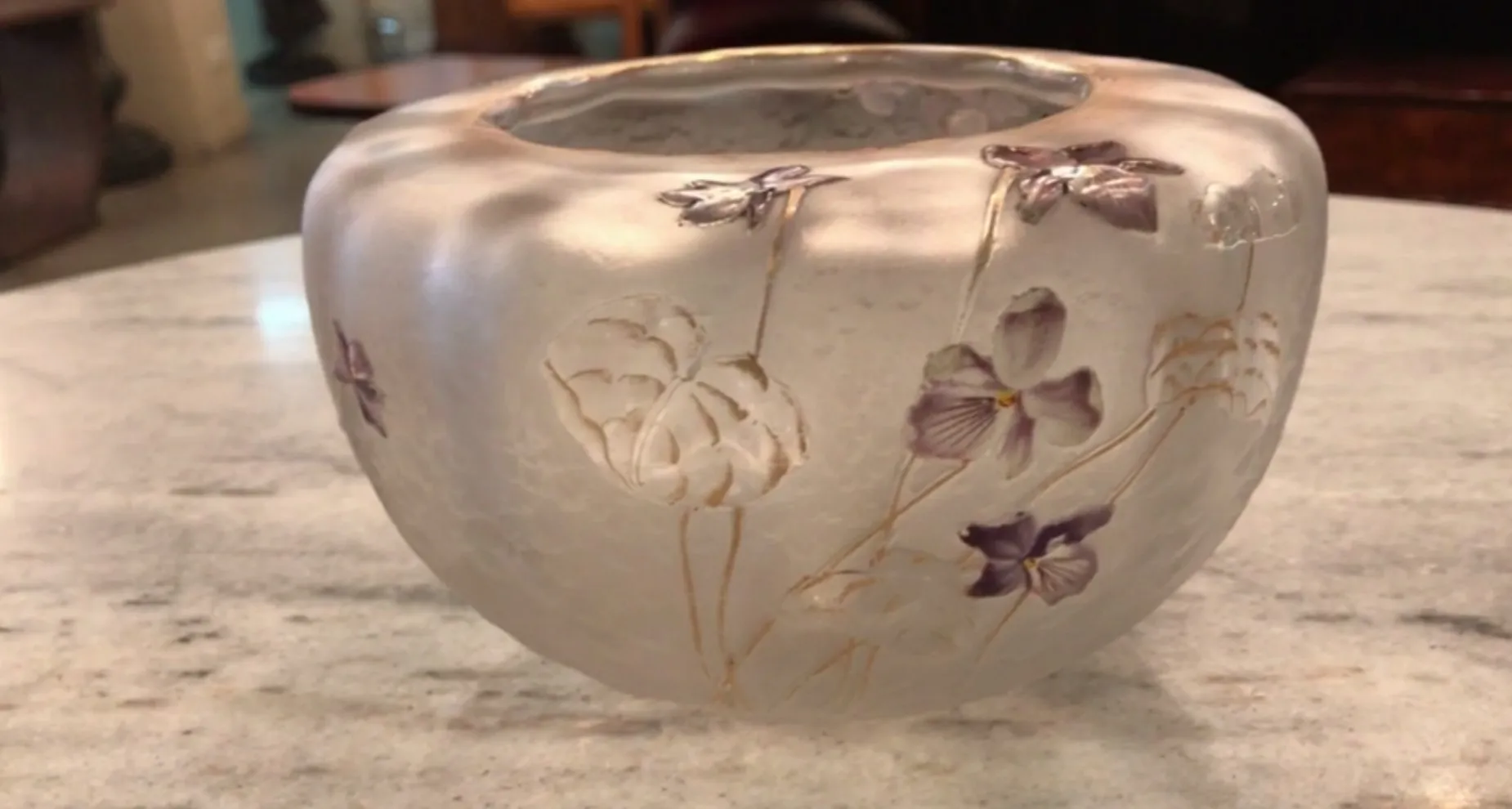antique glass with engraved flowers and daum nancy signature, cozy setting
