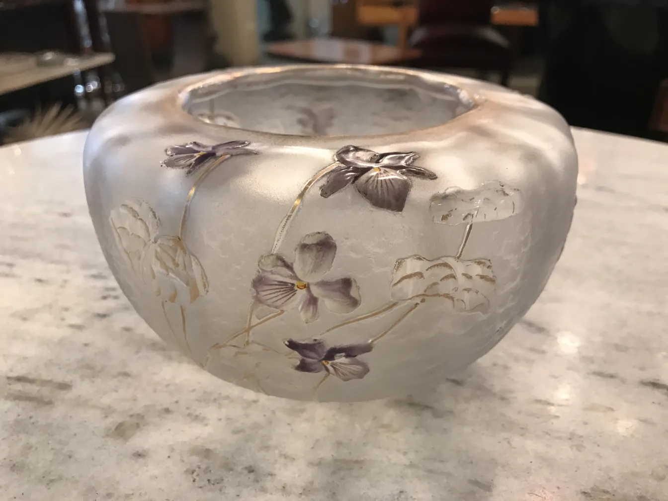 Antique glass with floral decoration in nearby area.