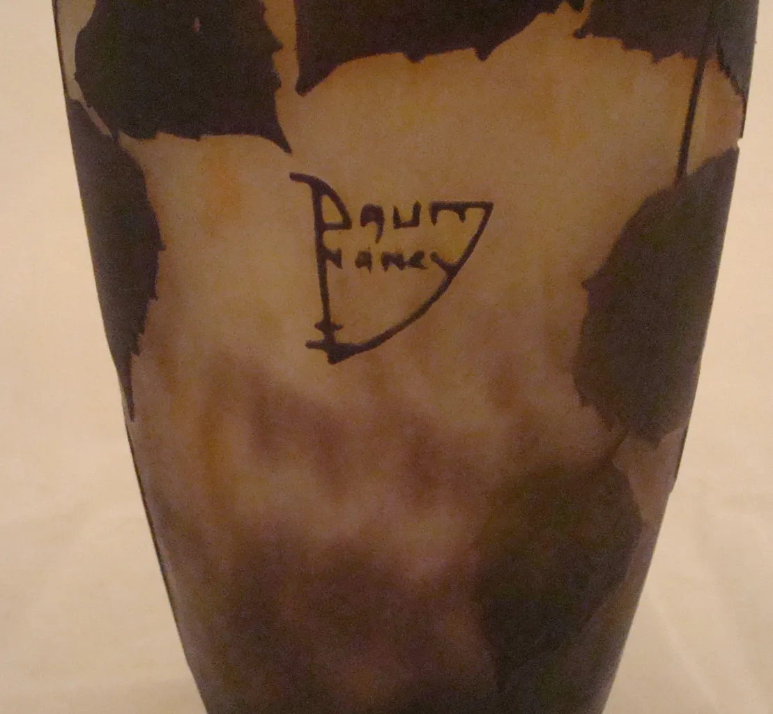 Antique glass with Daum Nancy signature, featuring an irregular design