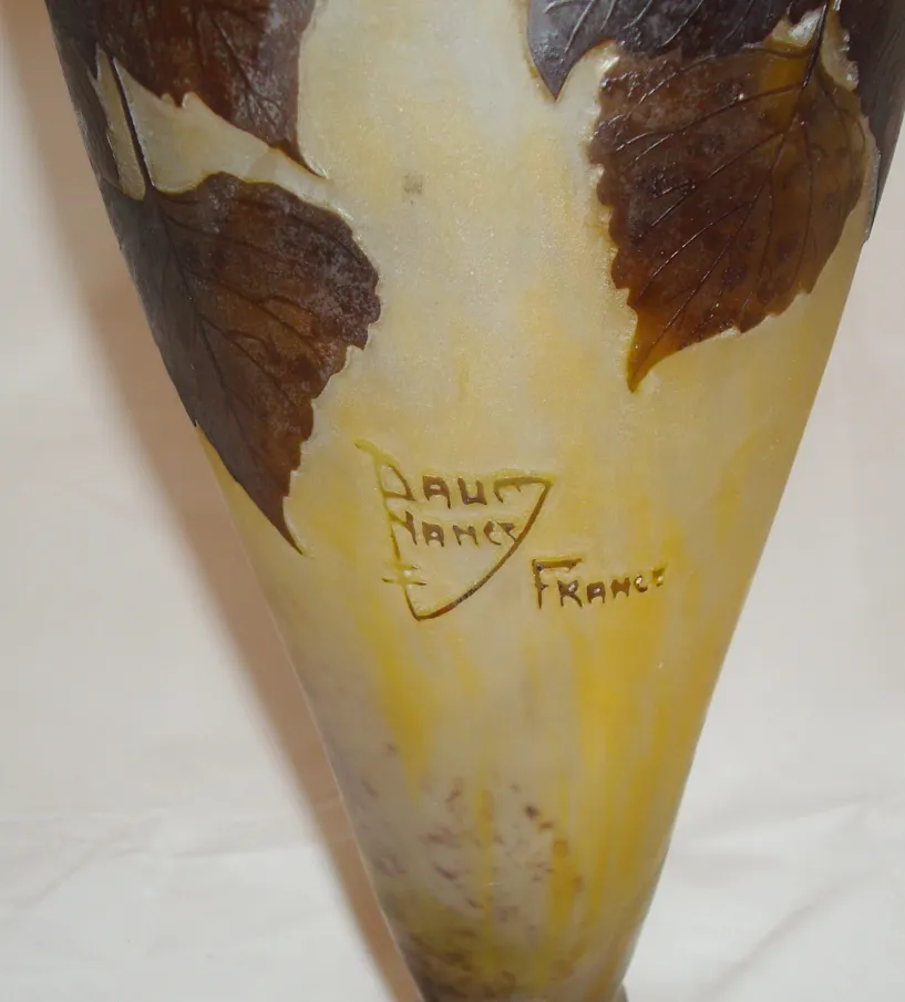 glass object with embossed leaves and daum nancy signature