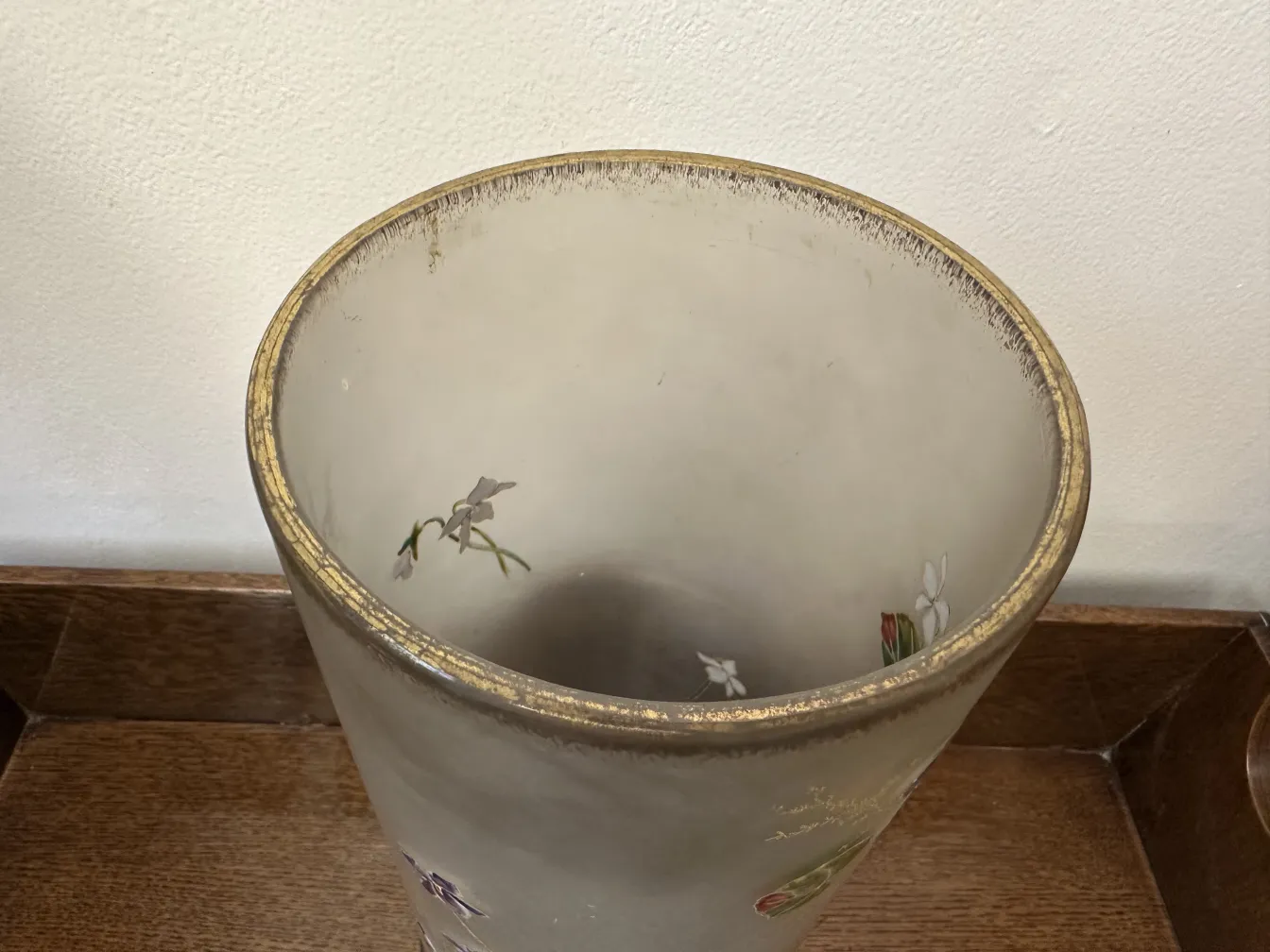 SIGNED GLASS Daum Nancy with floral design, antique cylindrical shape, soft background.