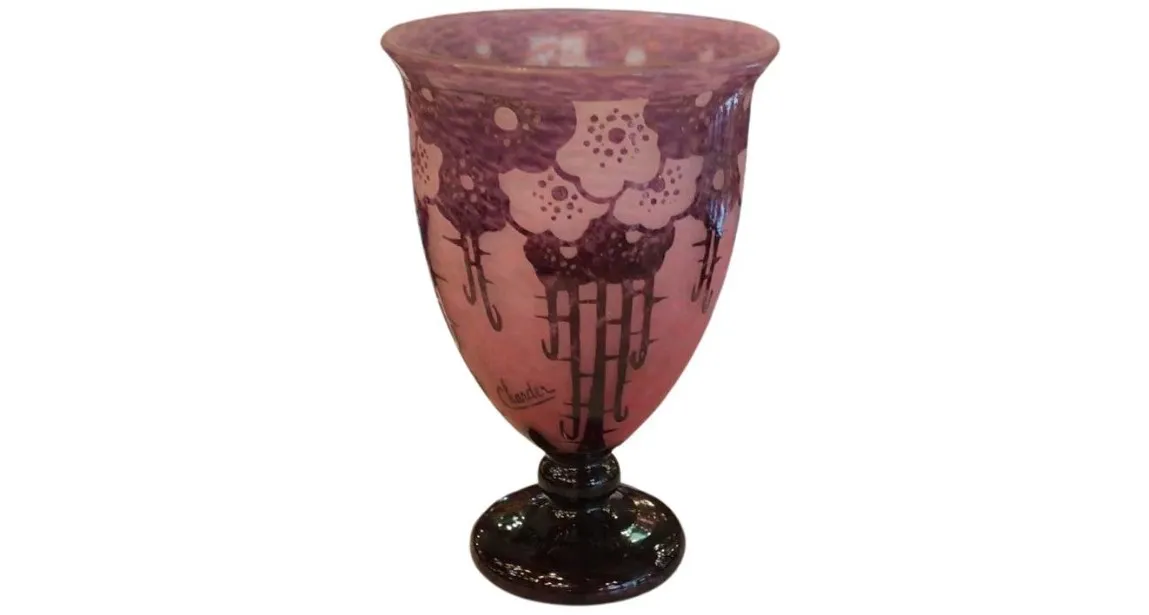 Signed glass with floral decoration in pink and purple hues.