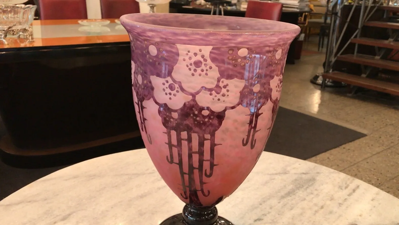 Signed Charder glass with floral decoration and black base