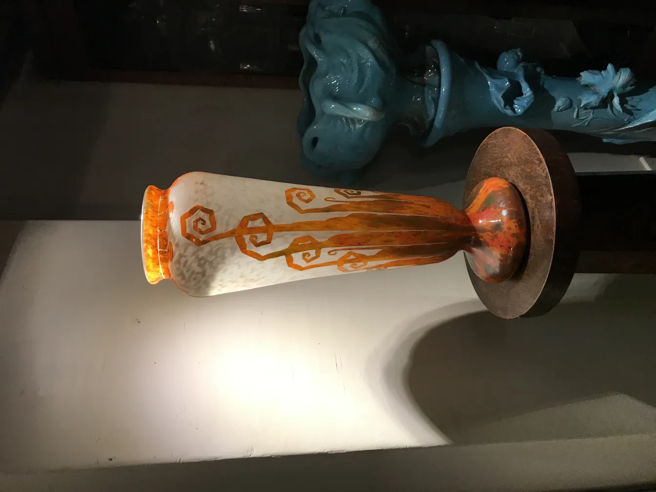Side view of antique signed glass Charder with decorative design