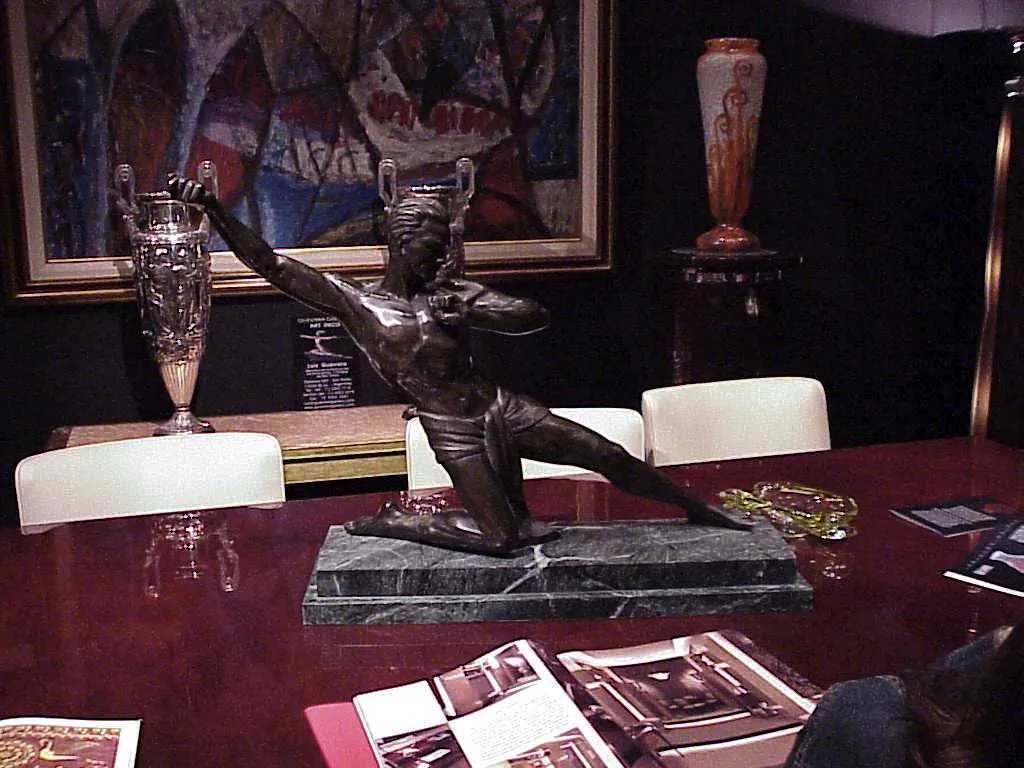 Signed glass by Charder in an elegant antique setting.