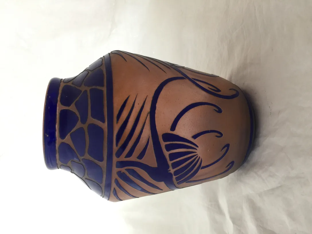 Signed glass Charder with detailed decorative pattern in blue and terracotta shades