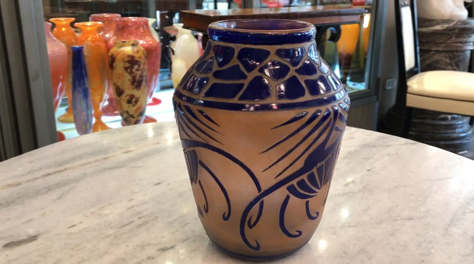 Signed glass by Charder with stylized antique decoration.