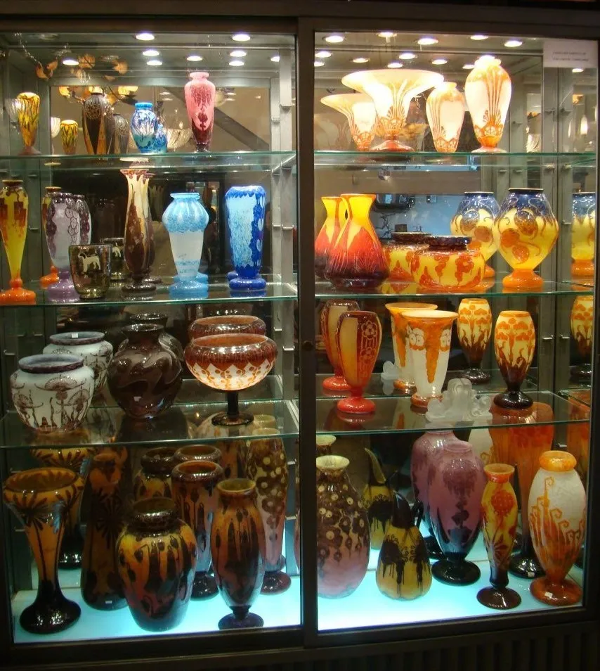 Collection of antique glass vases, including signed glass Charder