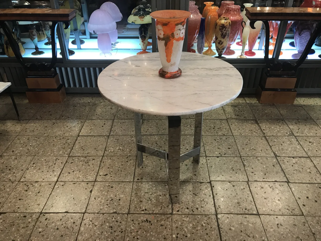 Signed Charder glass on table, with vases in background