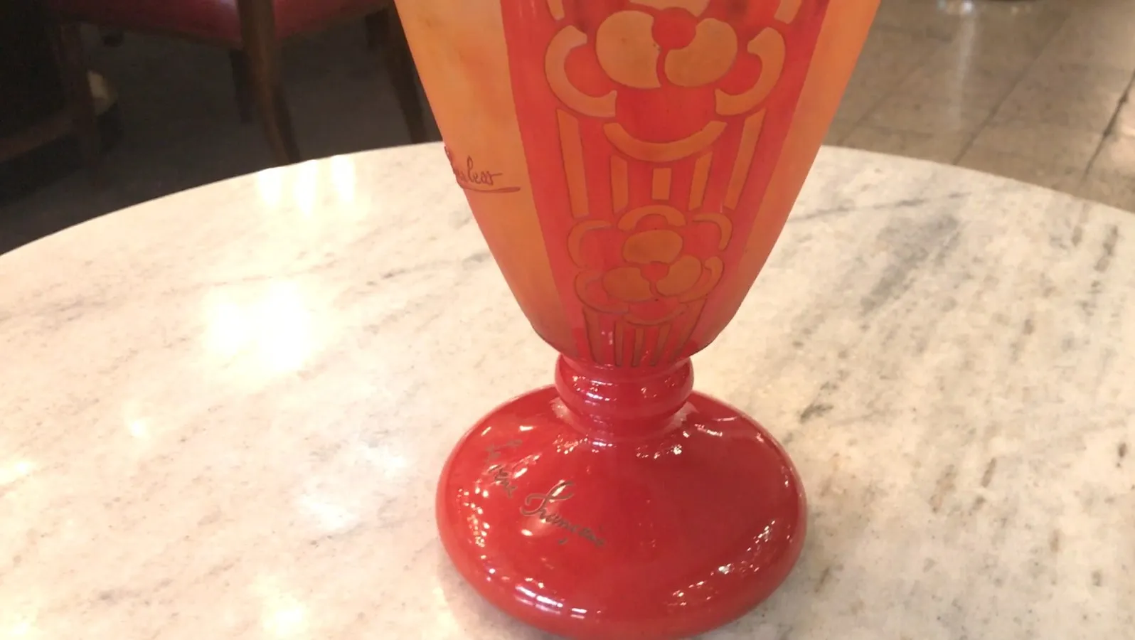 Antique signed glass by Charder, featuring warm tones and floral design.