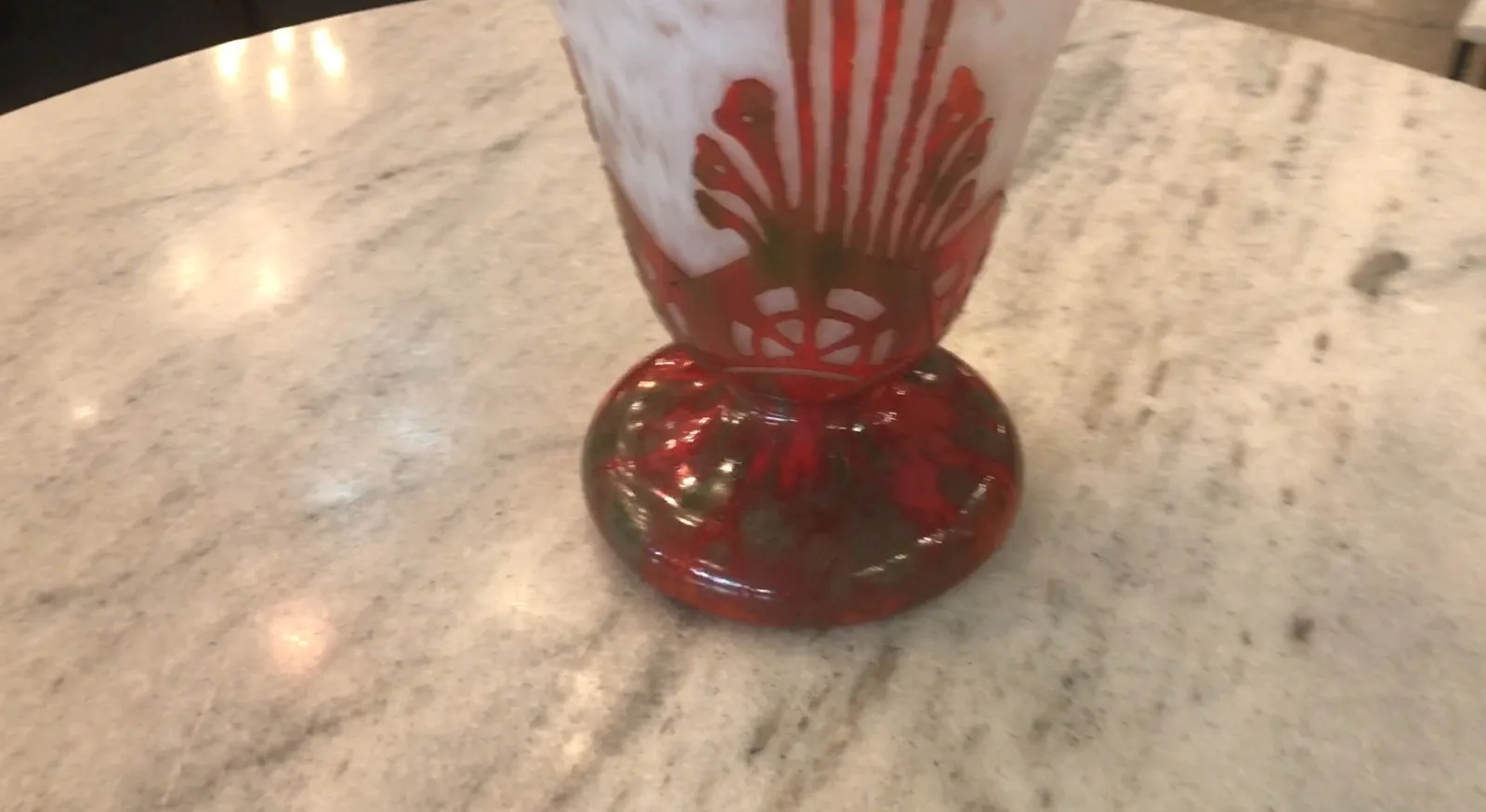 signed glass by charder with red and white patterns