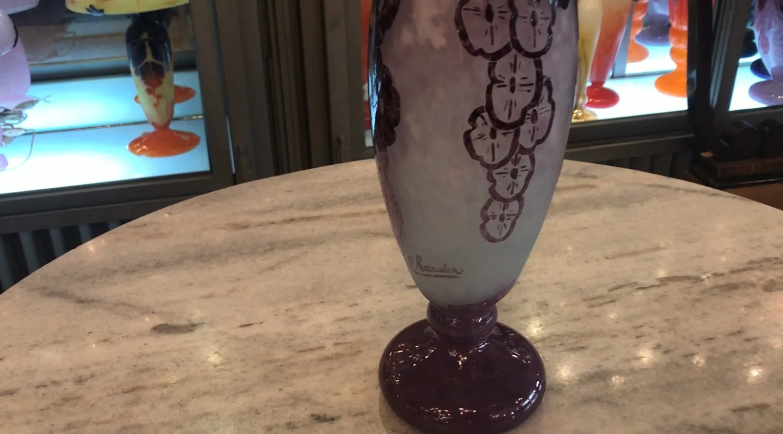 signed glass with decorative details against an interesting backdrop