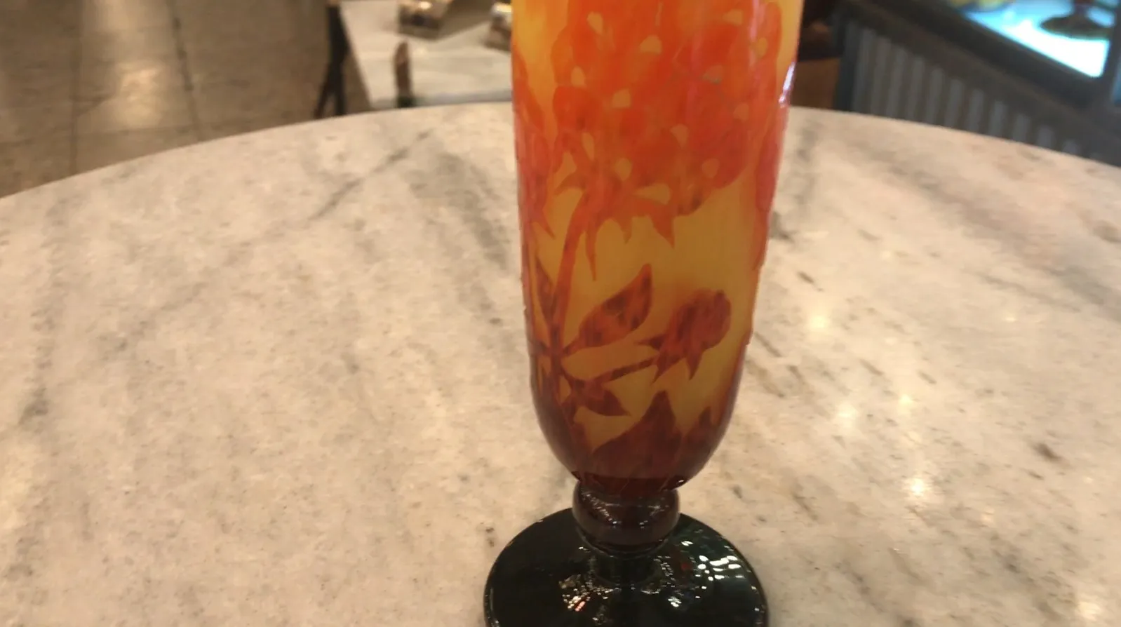 Signed Charder glass with floral design and black base.
