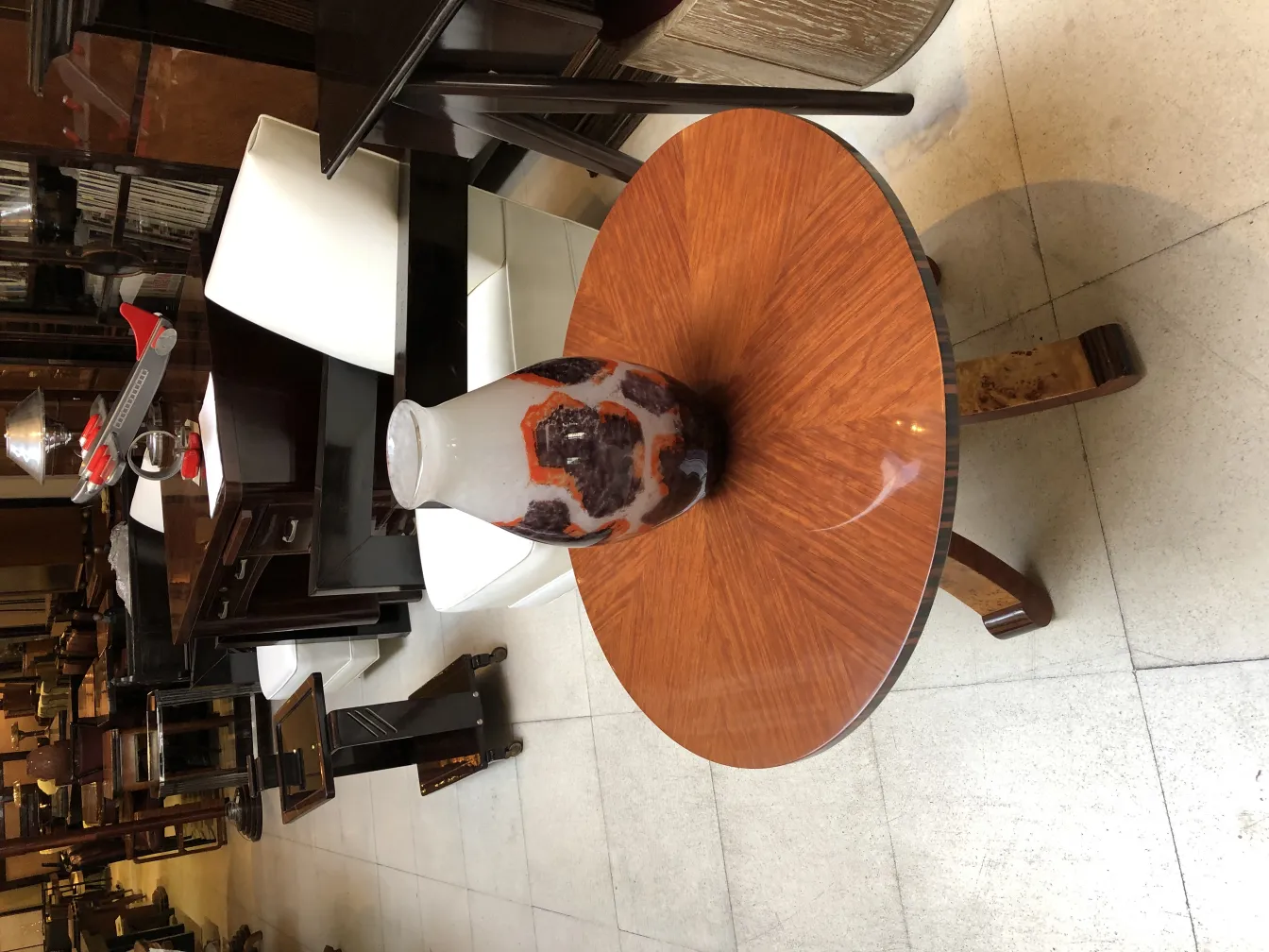 Degué signed glass in an antique setting with wooden furniture