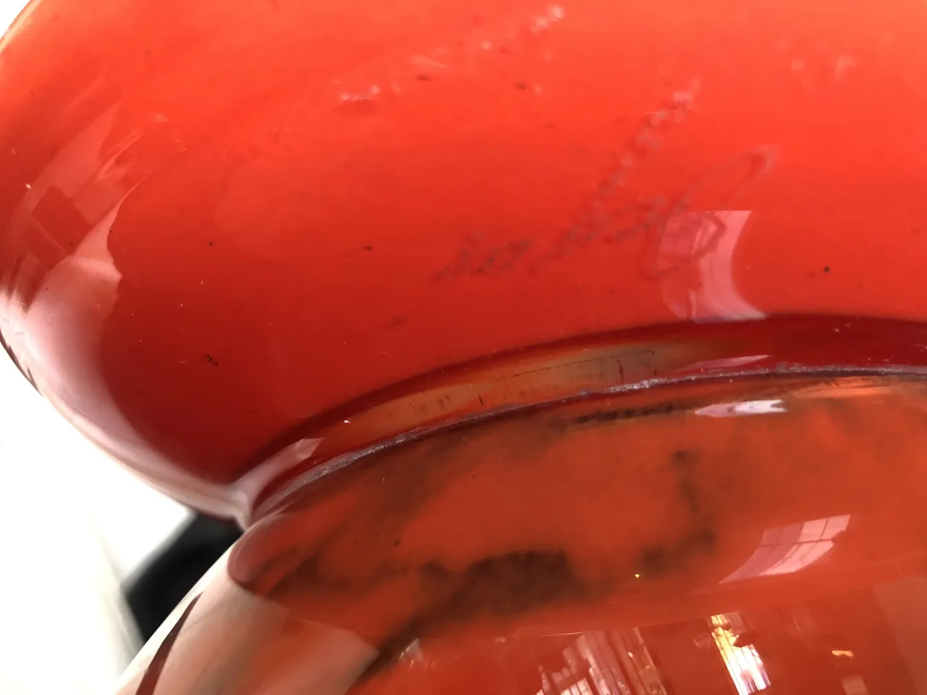 Antique signed glass Degué in red with signature details.