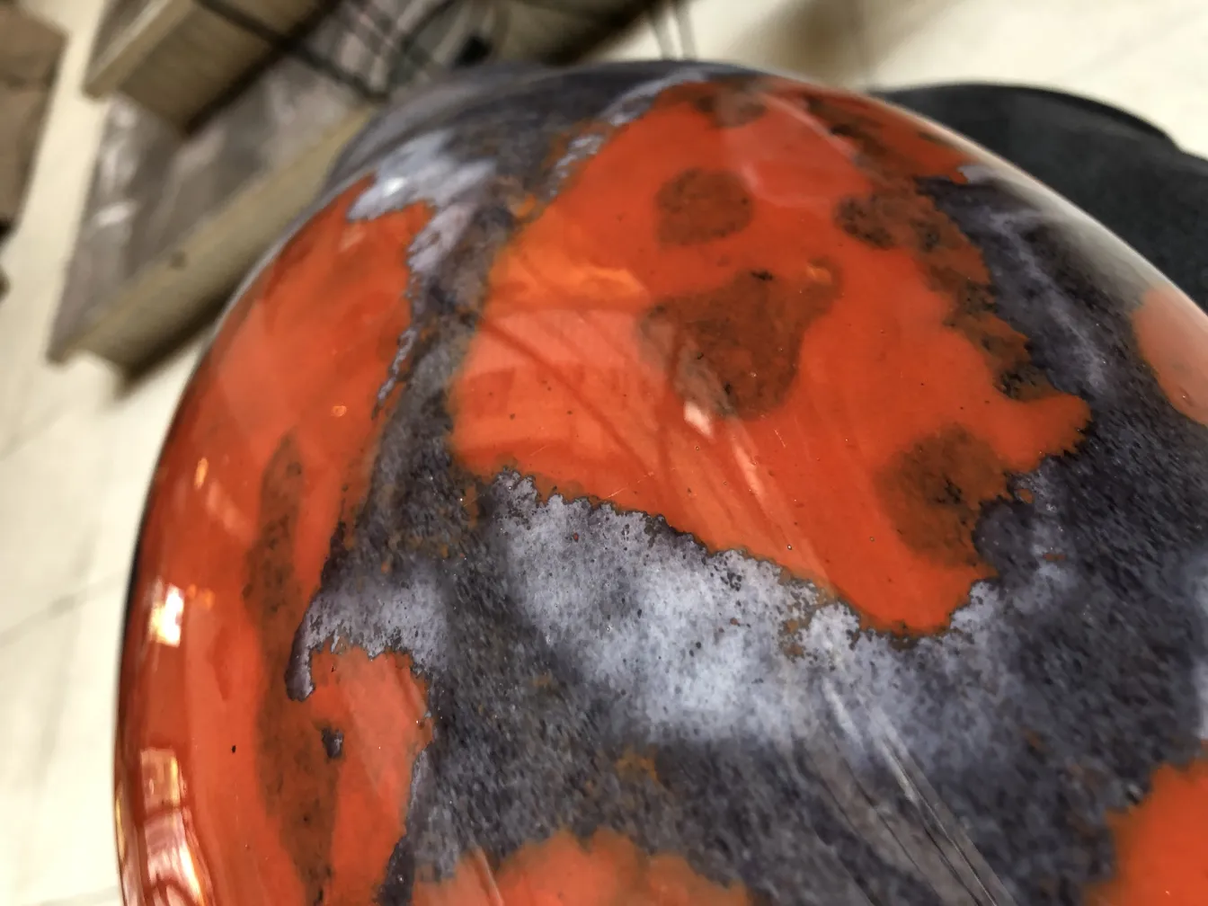 antique signed glass Degué with striking design and vibrant colors in an old setting