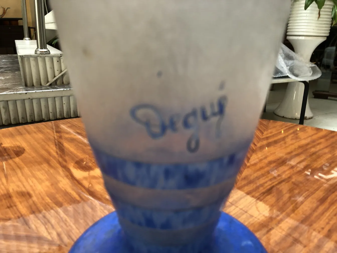 Signed glass Degué on a wooden surface, antique.