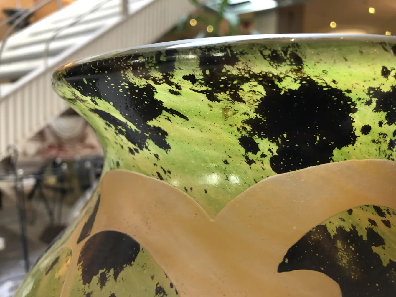 View of a vase with black and green details, antique signed glass Degué.