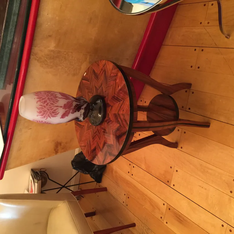 Signed glass Degué on an antique decorative table