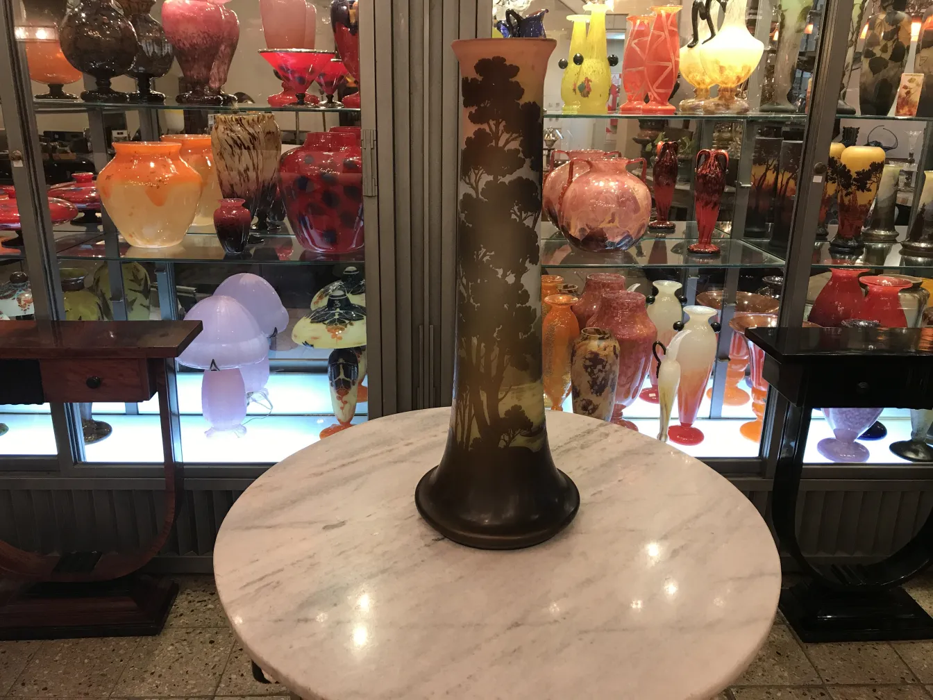Antique decorative signed glass Gallé, surrounded by colorful other antiques.