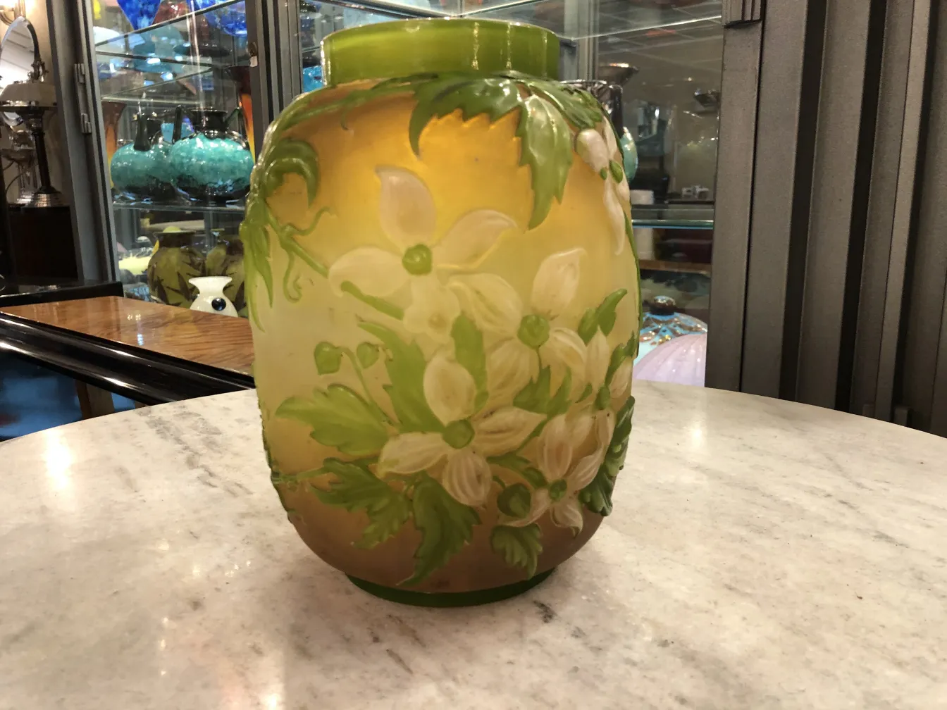 antique glass vase with raised flower designs by Gallé