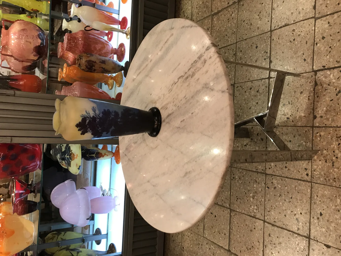 Signed Gallé glass with decorative details and varied background