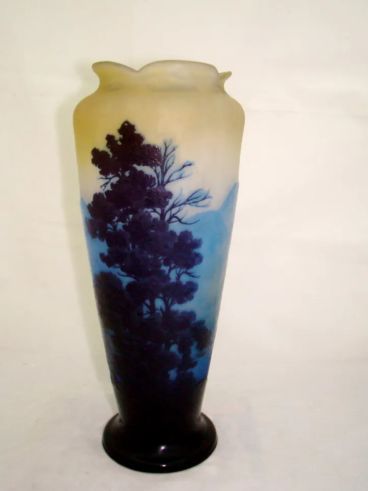 signed glass gallé featuring landscape images in dark and light tones