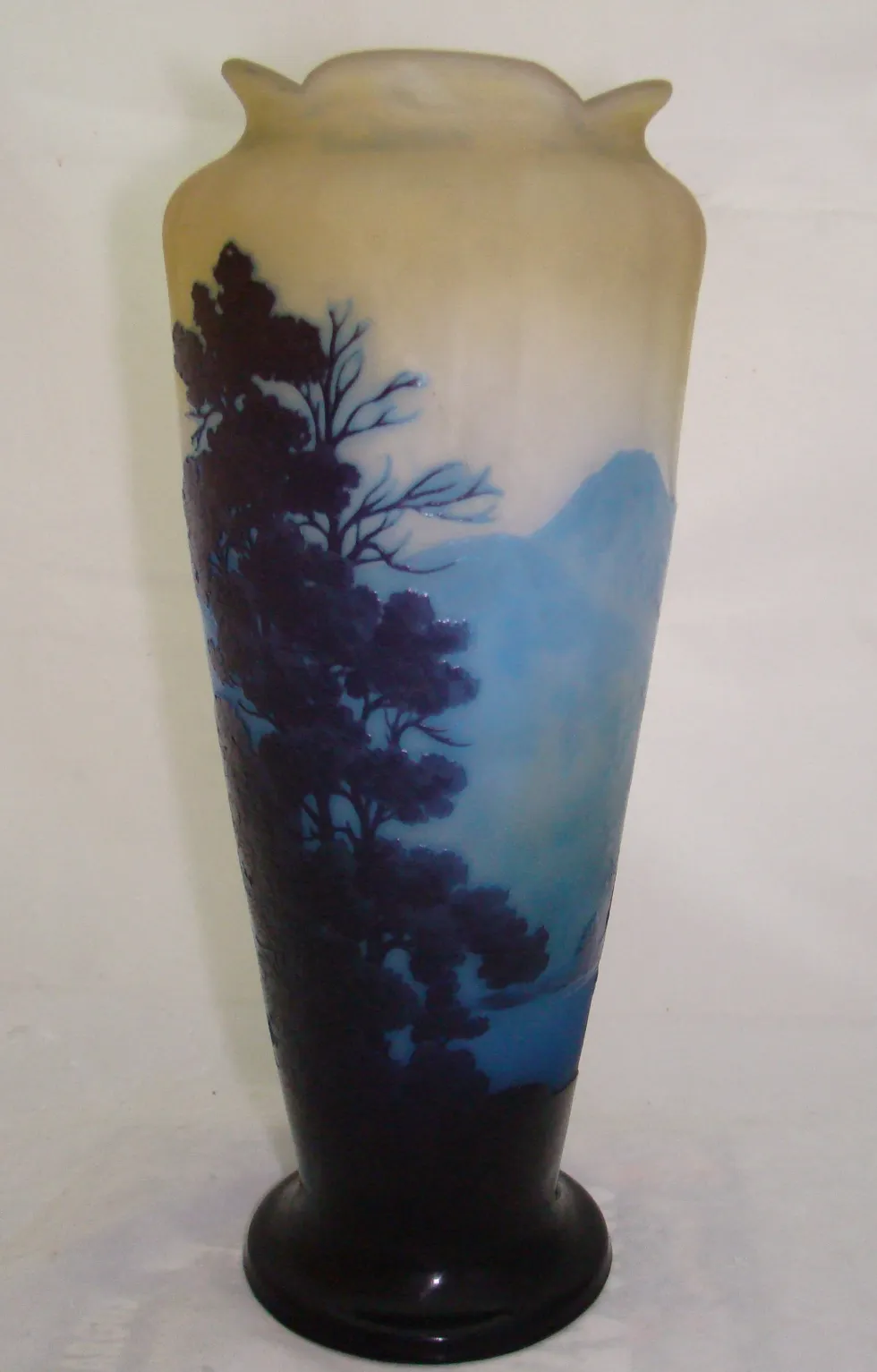 Antique signed glass vase by Gallé featuring a blue-toned landscape.