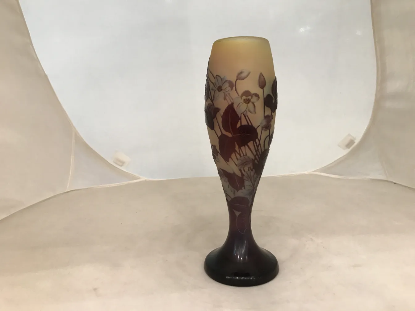 Signed Gallé glass with floral design, dark pedestal