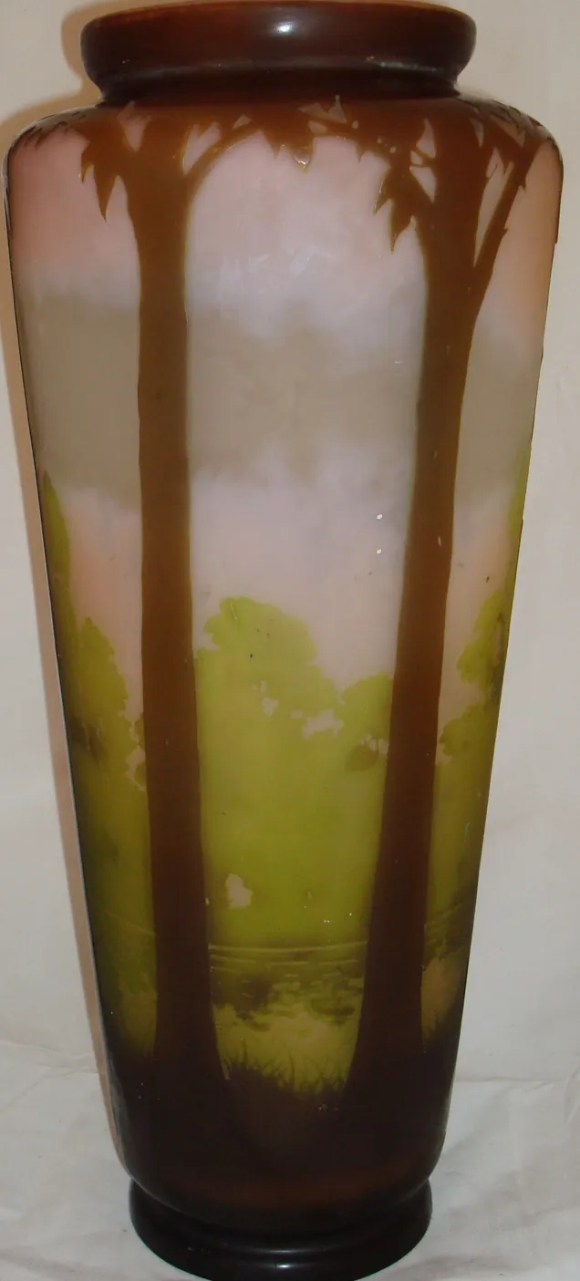 antique vase decorated with green tree design