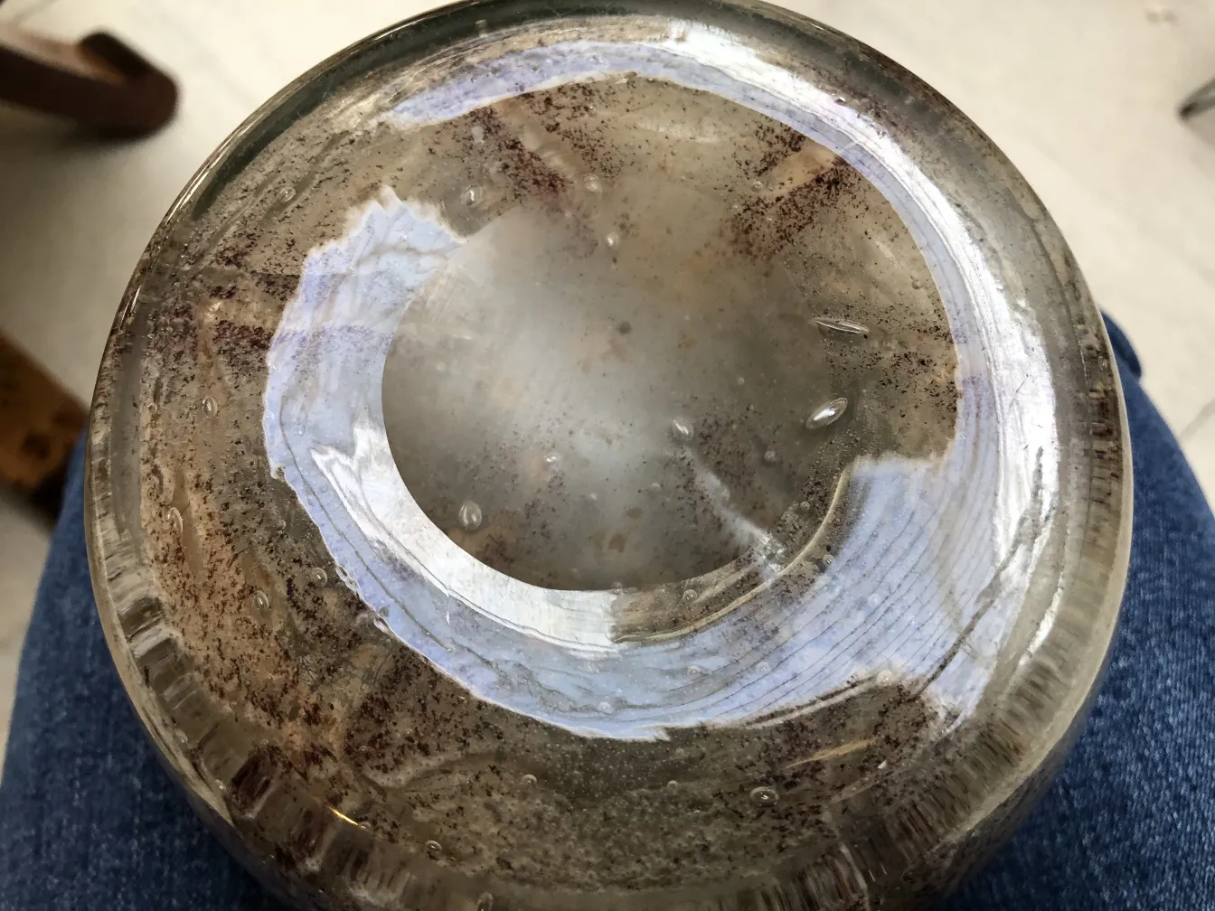 Antique signed glass with unique base details and texture.