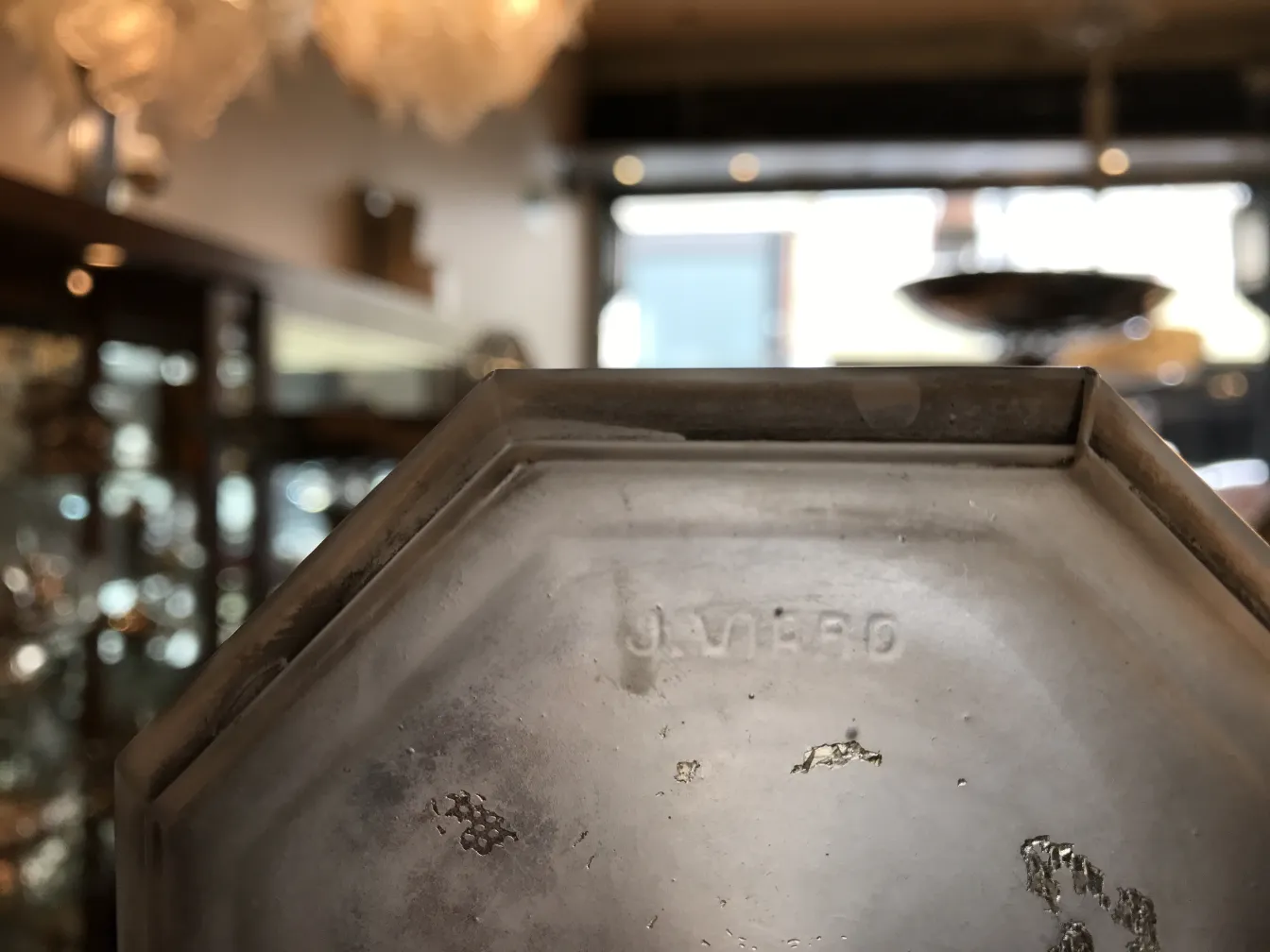 Signed glass with visible inscription, in an antique setting