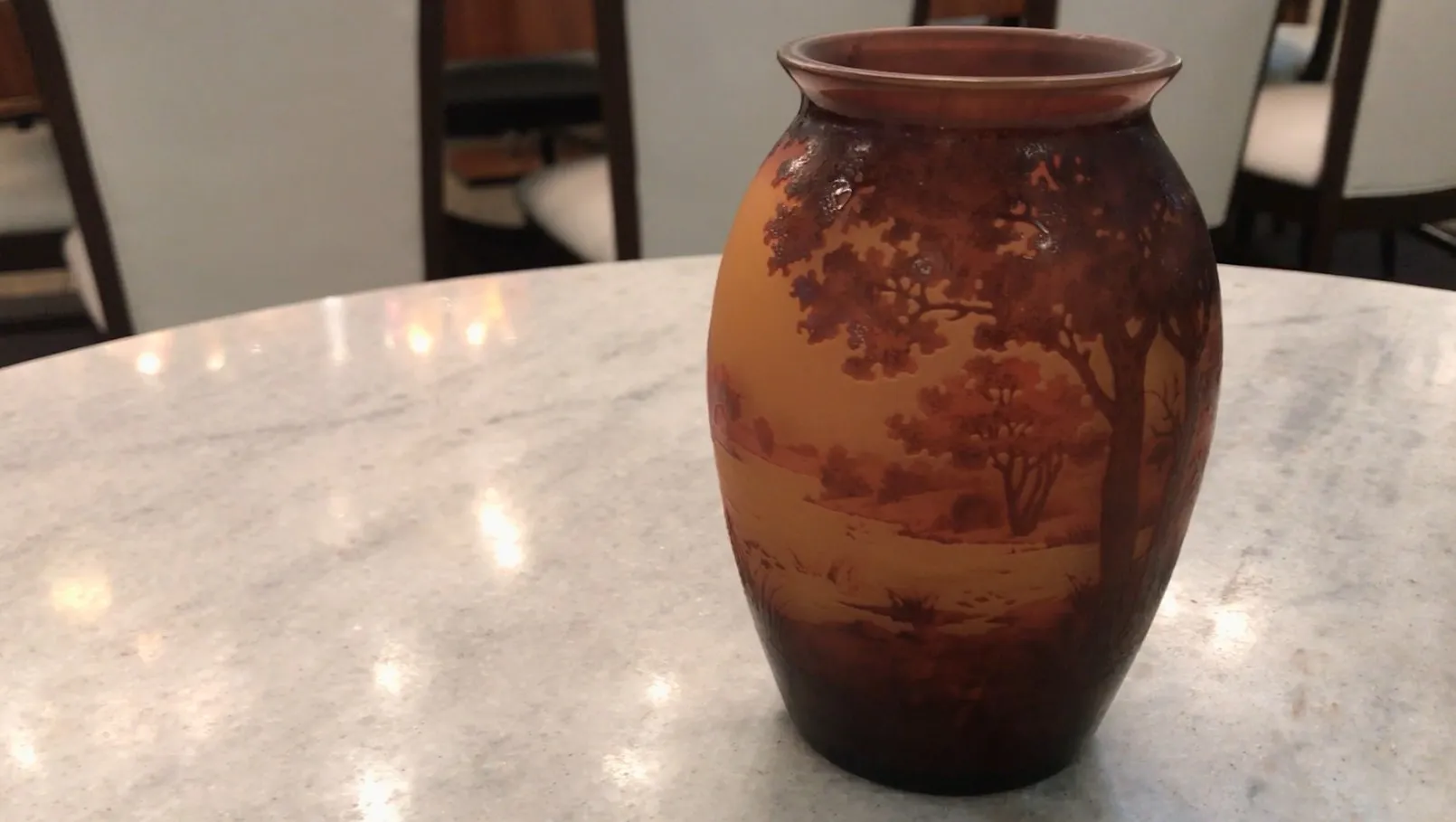 signed glass d'argental featuring painted landscape details