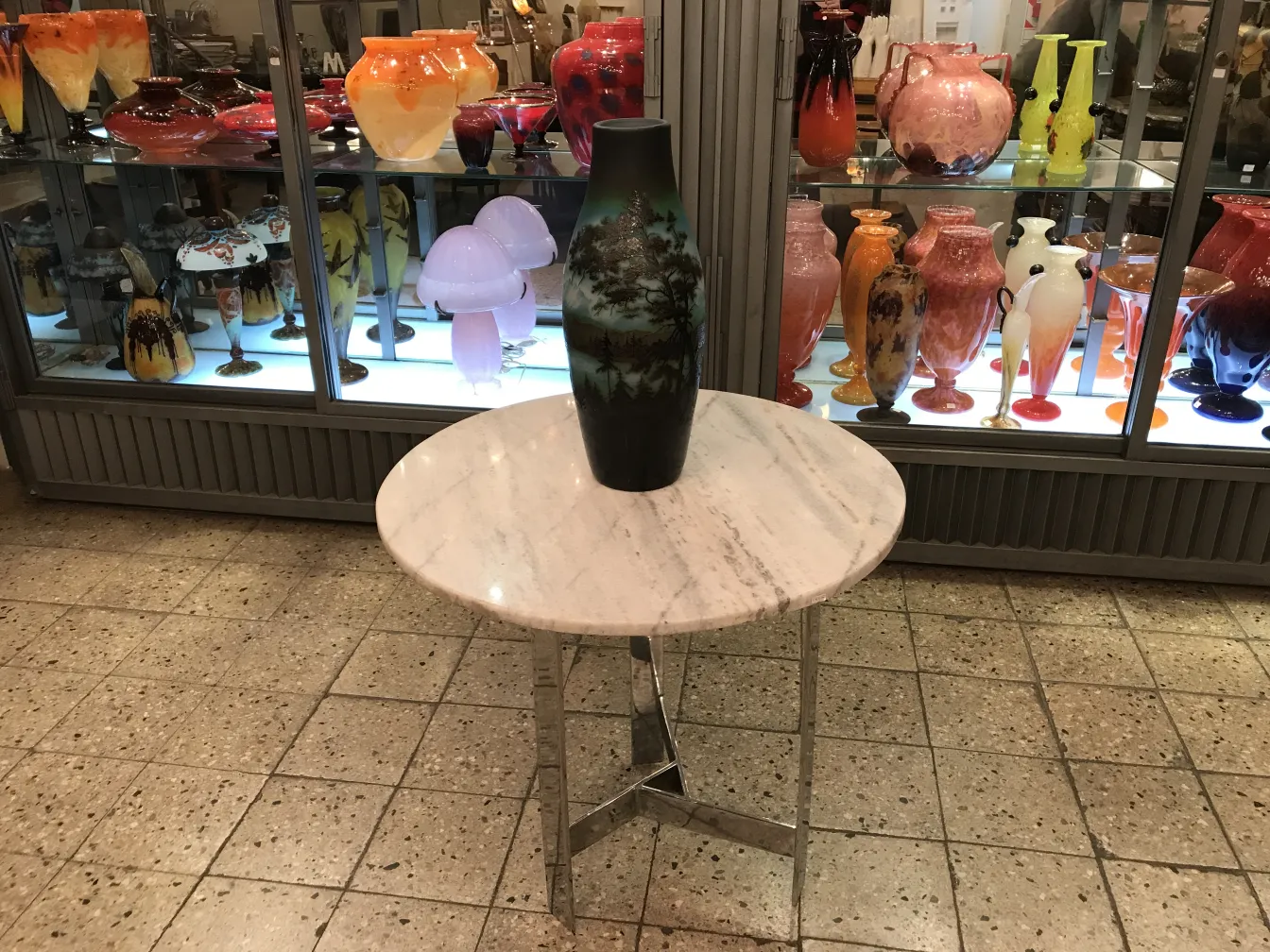 Antique signed D'Argental glass on a marble table