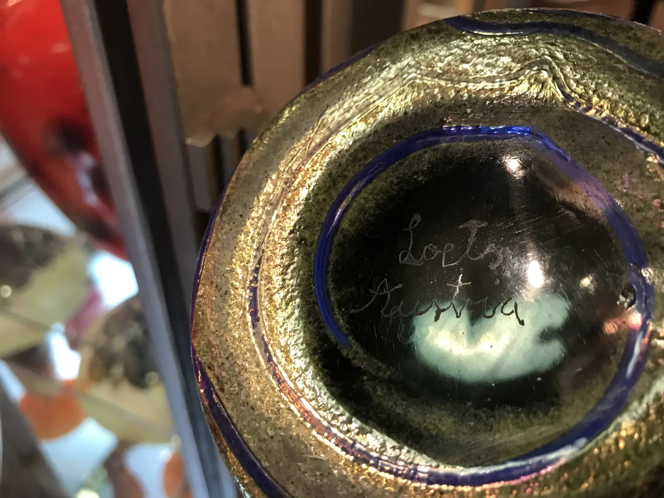 Antique glass with Loetz signature, elegant patterns and colors