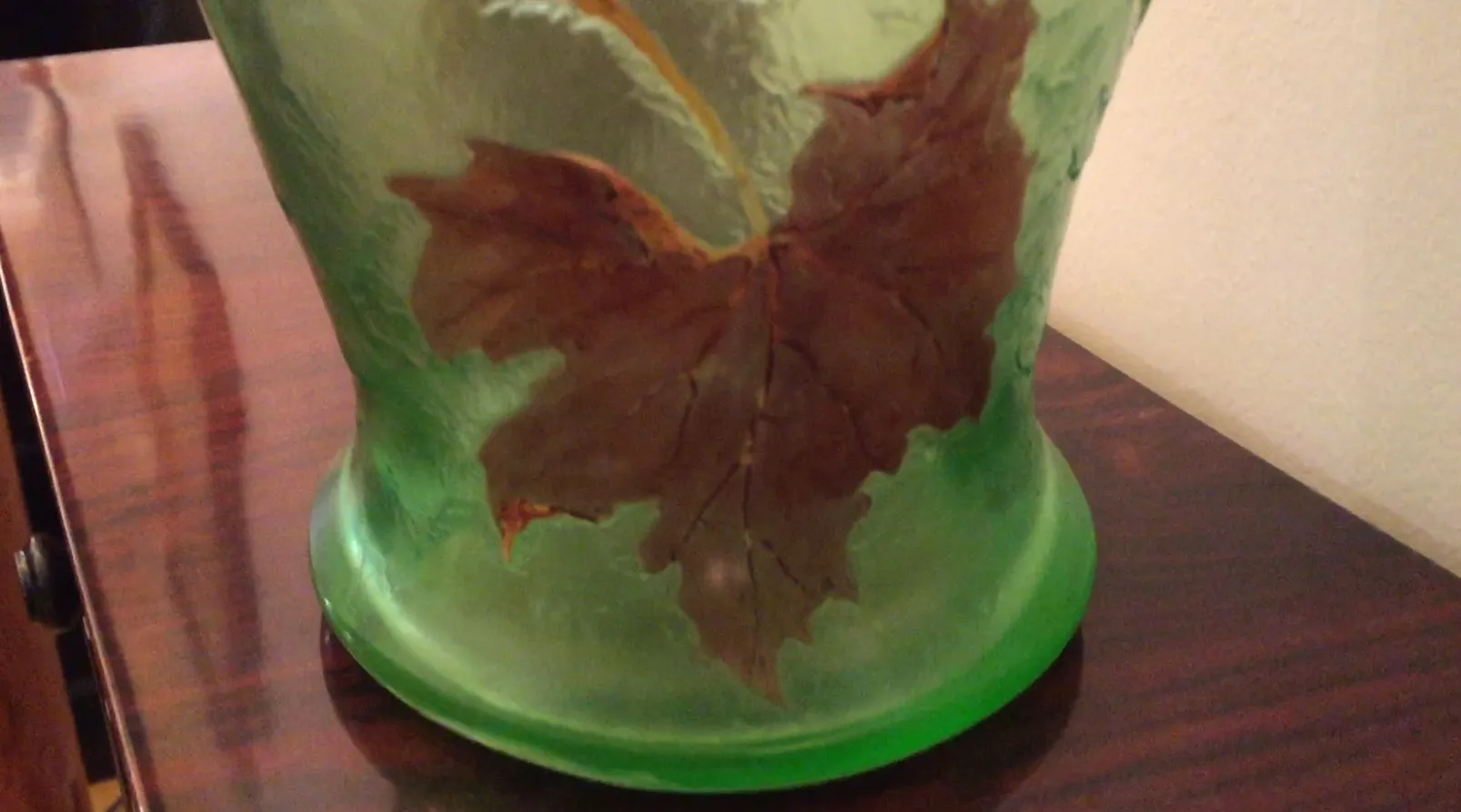 Signed glass LEGRAS featuring leaf design in green.