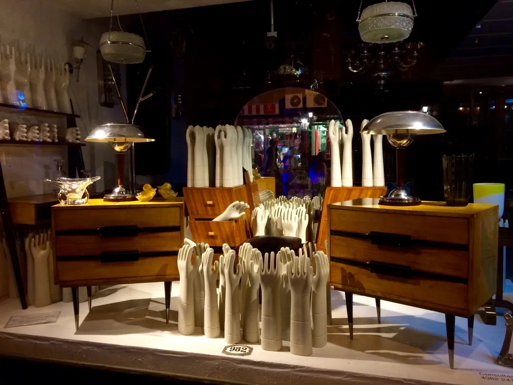 antique bedside tables in a styled display with decorative elements