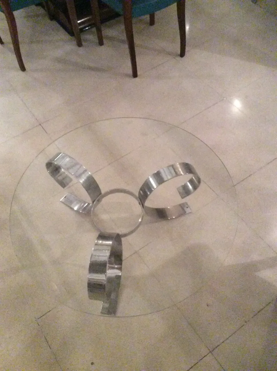 antique coffee table with curved center design and arch base