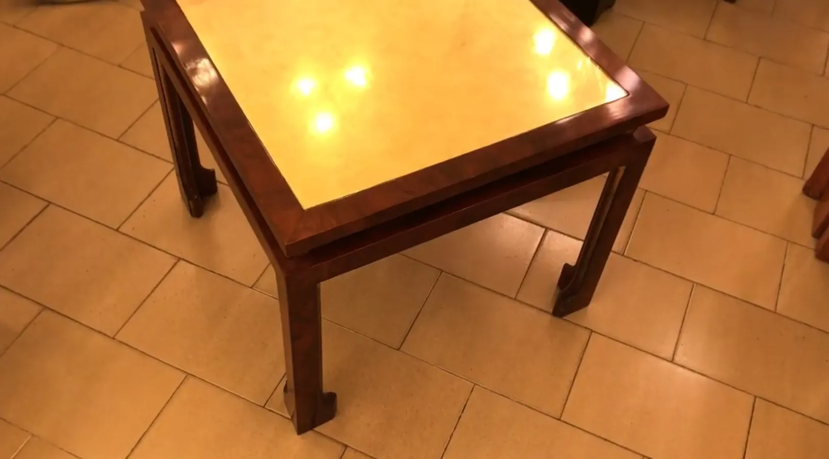 antique coffee table in brown with light surface, cozy atmosphere