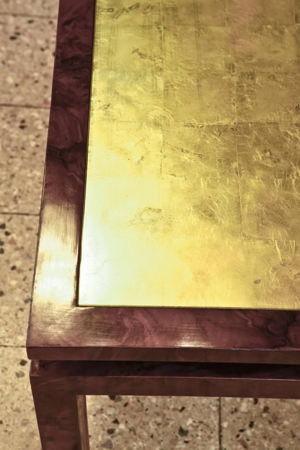 Antique coffee table with a shiny surface in an elegant setting.