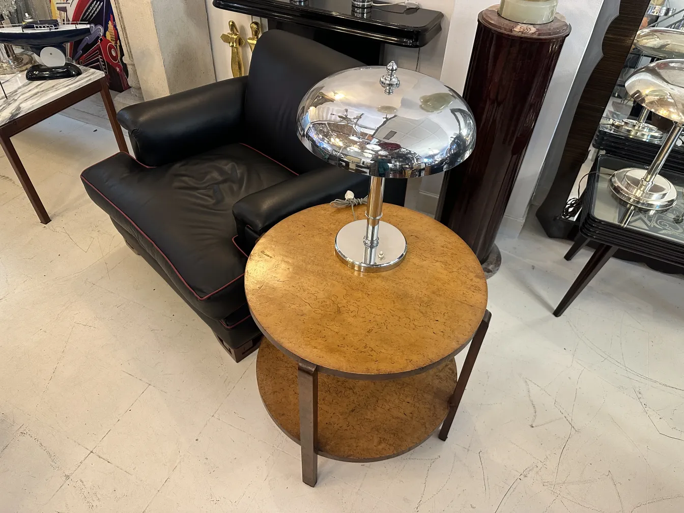 small antique round table with lamp and modern surroundings