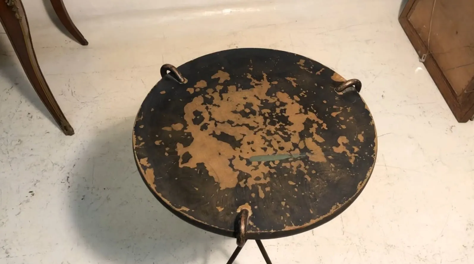 antique round small table with vintage design and visible wear