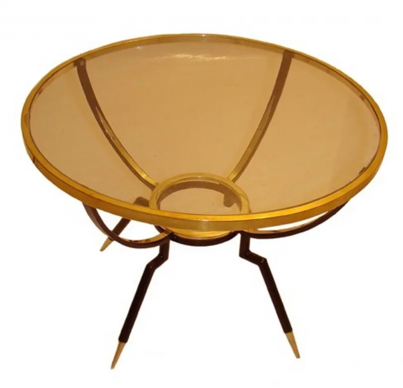 mesita antigua con diseño circular y patas estilizadas