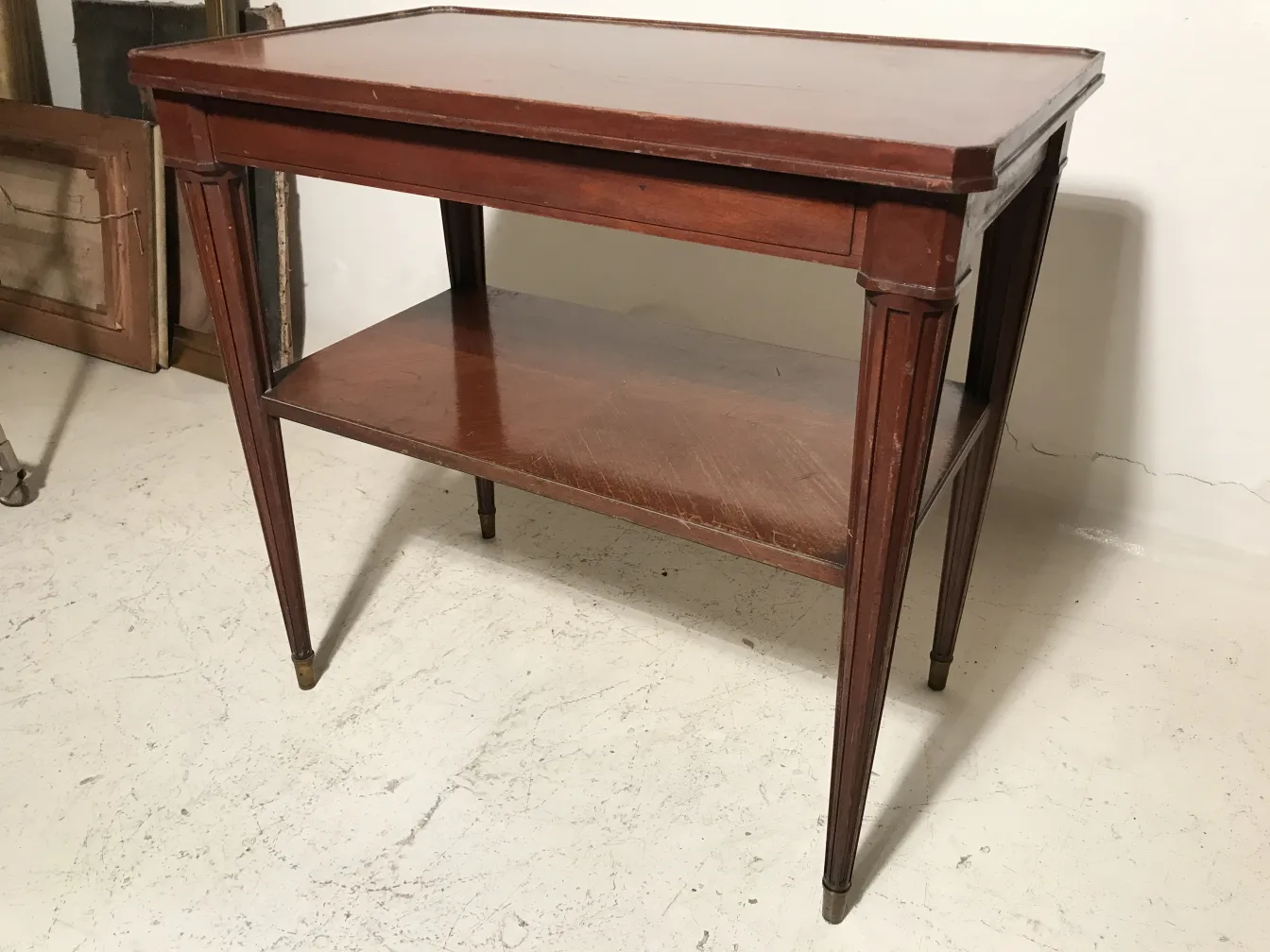 antique small table with two levels and elegant legs
