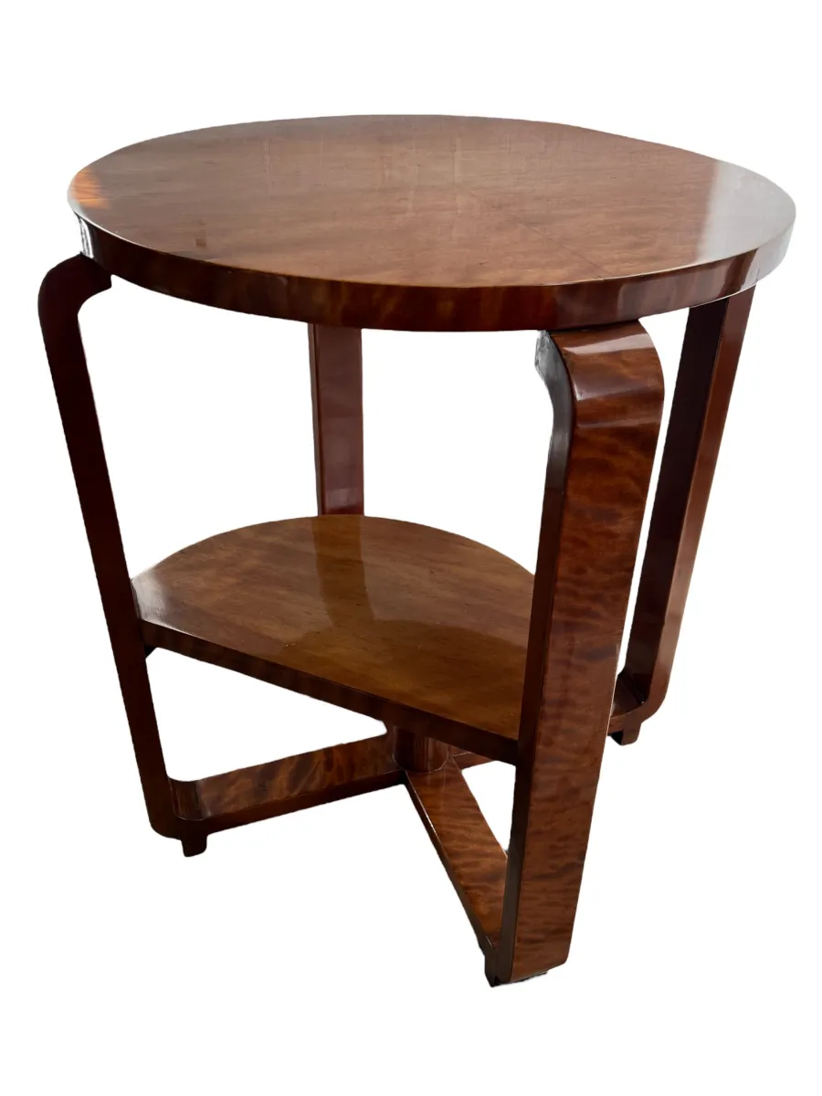 antique small table with a round top and lower shelf